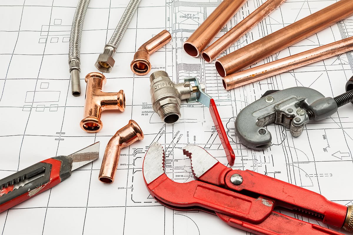 Plumbing and heating engineer carrying out a repair